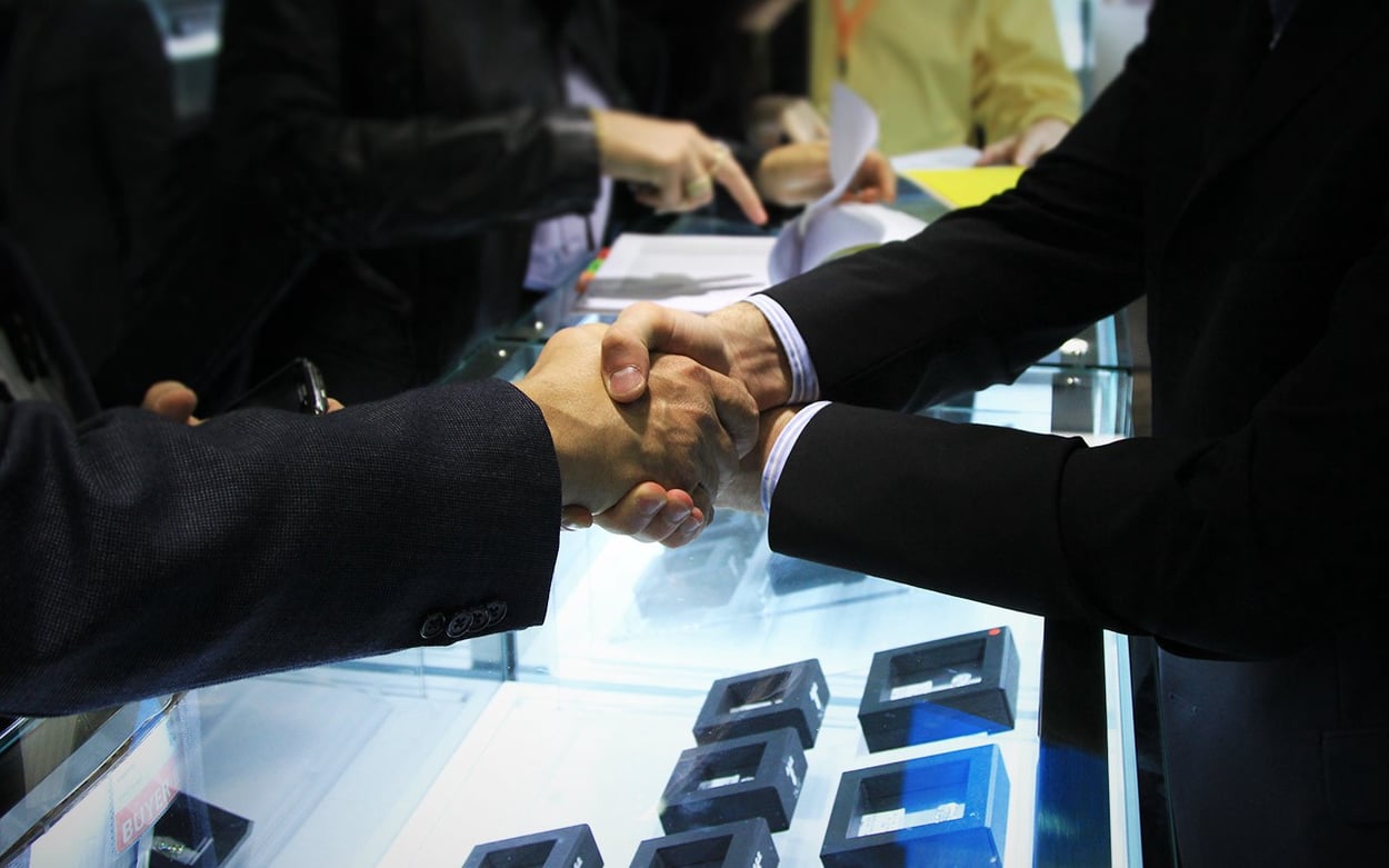 A handshake and “Mazel Und Broche.” A deal is done. | Facets Singapore